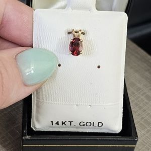New. 14k garnet pendant! Stamped 14k. Oval cut garnet.  See all pics!  I have qu